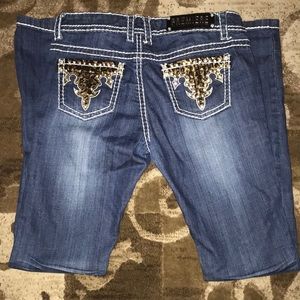 Embellished pocket and ripped jeans